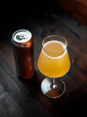 Craft banana cider or mead on a wooden table. Refreshing summer alcohol drink