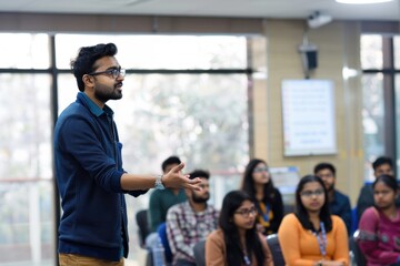 Male instructor speaking to students