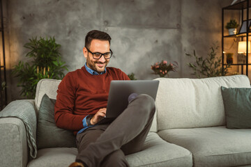 Adult businessman work from home on laptop