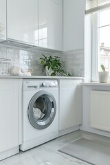 Gray washing machine is placed in the corner of an open space,