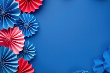 Obraz premium a blue background with red, white and blue paper fans for USA national holiday decoration Web banner with empty space Generative AI