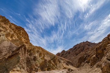 mountains with wispy clouds and sky