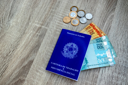 Brazilian work card. Registered work CLT and money from Brazil. Minimum wage Brazilian real money.