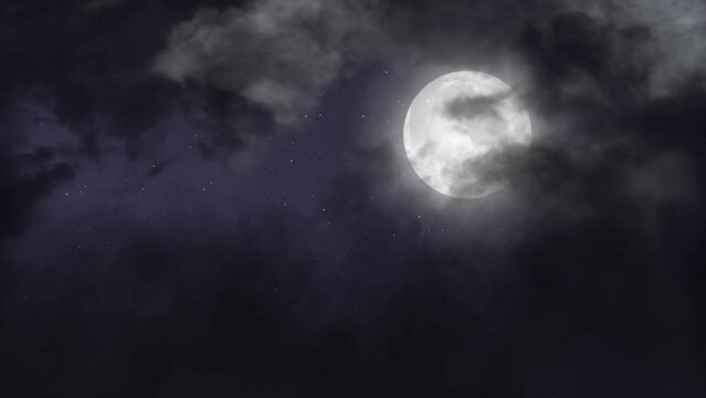 Full Moon Surrounded By Clouds in the night sky.