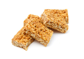 Honey bars with peanuts on white background