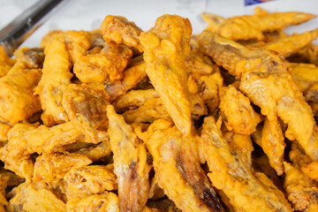Chicken wings coated in batter and fried