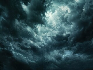 The dark sky with heavy clouds converging and a violent storm before the rain. Bad or moody weather sky and environment
