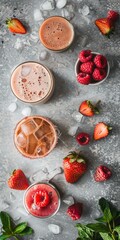Fototapeta premium Refreshing summer cocktails with vibrant strawberries and raspberries on ice gray background, vacation vibes, relaxation, and good times.