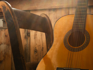 Classical guitar strings on wooden background