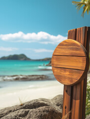 A wooden sign sits atop a sandy beach, providing a rustic touch to the coastal scenery