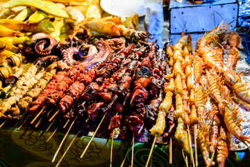 Different seafood for sale at the Forodhani gardens in Stone town at night. Zanzibar, Tanzania