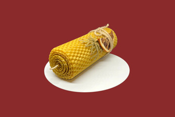 A decorative yellow twisted candle