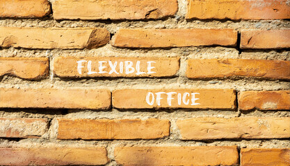 Flexible office symbol. Concept words Flexible office on beautiful brick wall. Beautiful red brown brick wall background. Business Flexible office concept. Copy space.