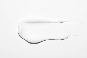 White cosmetic cream texture, skincare lotion swatch on white background. Face creme, body moisturiser, hair conditioner smear smudge stroke. Creamy beauty product closeup