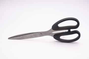 Used scissors that are a little dirty and rusty. made of stainless steel isolated on a white background.
