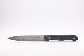 Used kitchen knife with black handle isolated on white