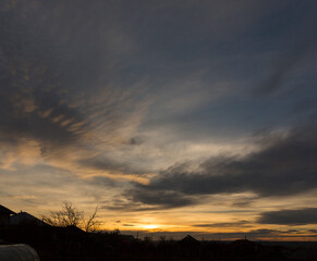 Landscape at sunset. Tragic gloomy sky. Panorama. Crimson twilight.