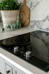 Fototapeta premium A black stove top sits on top of a kitchen counter, perfect for cooking and baking
