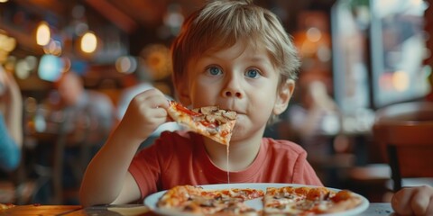 A young boy taking a bite of his favorite pizza snack