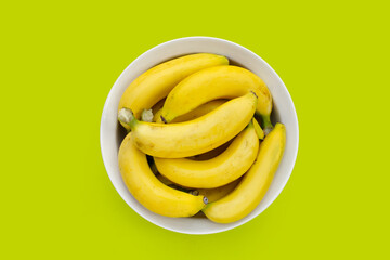 Banana fruit on green background.