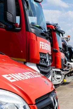Fire brigade emergency response vehicles parked in a row