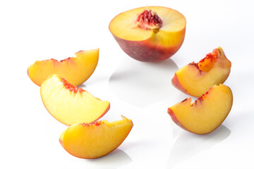 ripe nectarine with leaves isolated on white background. Top view. Flat lay pattern 1