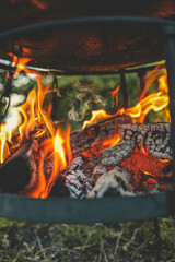 Barbecue Grill Pit With Glowing And Flaming Hot Charcoal Briquettes, Close-Up