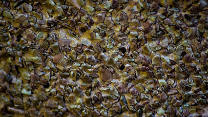 Wall surface made of brown pebbles, background