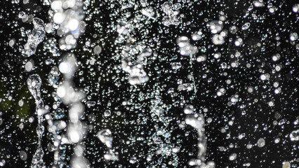Obraz premium Flying water drops on black background