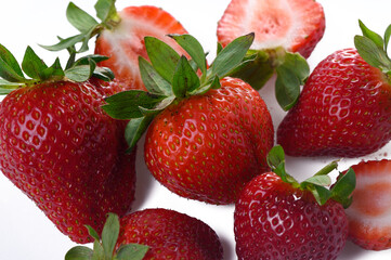 Close up of fresh red strawberries on a white background