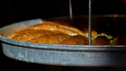 Turkish traditional dessert baklava with pistachio and walnut close up