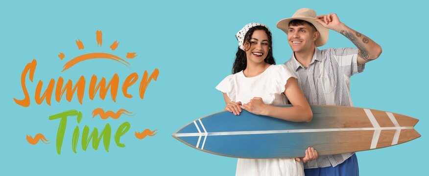 Happy young couple with surfboard on blue background. Summer time