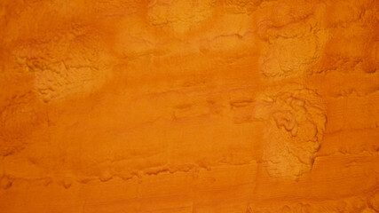 Fototapeta premium Orange painted wall background pattern