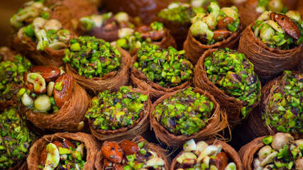 Turkish traditional dessert baklava with pistachio and walnut close up