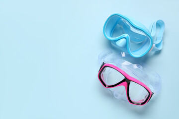 Different swimming masks on blue background