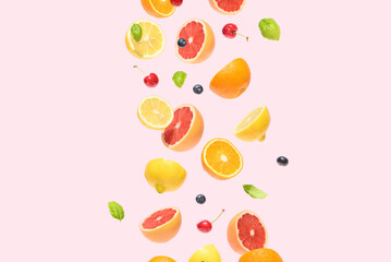Citrus fruit on a pink background. Summer aesthetic floating concept.