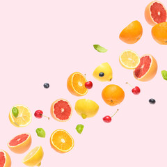 Fruits flying on a pink background. Summer food concept.