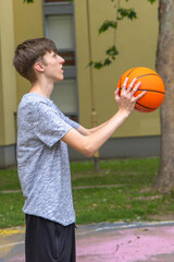 Young Man Practicing Basketball During Daytime