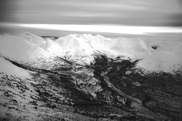 Snowy mountains, aerial view, black and white, Yukon, Canada