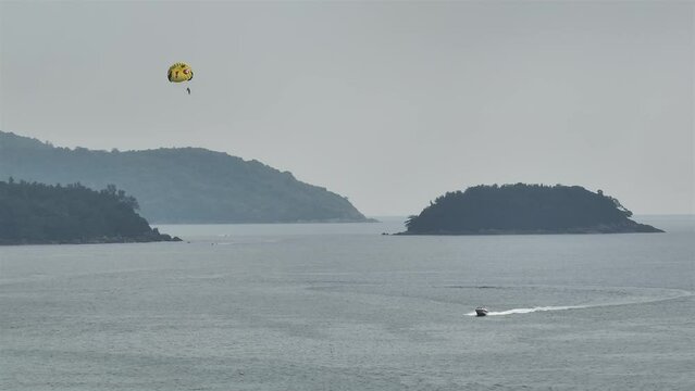 day time phuket island bay famous tourist parasailing flight aerial panorama 4k thailand