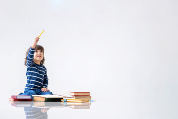 Education and back to school concept. Portrait of Happy little child boy learning to drawing and coloring on a book. Preschool children kids enjoy and fun study and doing homework at home.