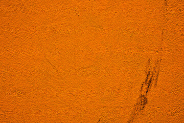 Closeup of orange dirty plastered wall