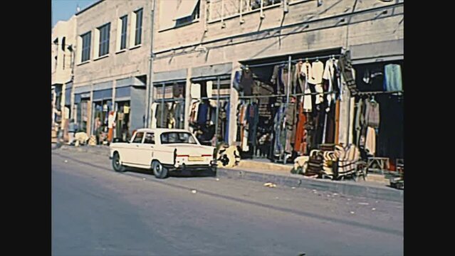Haifa, ISRAEL - CIRCA 1979: Haifa Israeli port city by the Mediterranean sea. Shops on the street with traditional clothes and handmade furniture. Historical archival footage in the 1970s of Israel.
