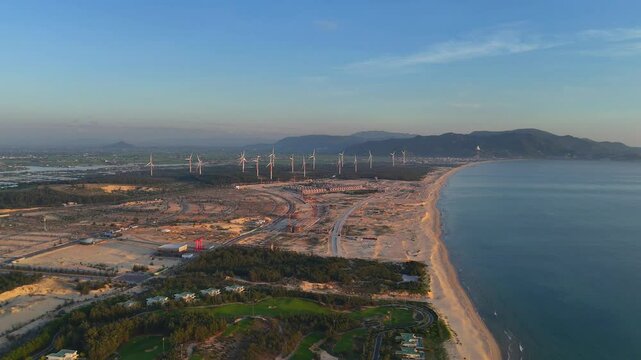 Wind turbines at FLC Nhon Ly seaside, turbine rotating to make green alternative energy with cheap for indusrtry and save environment