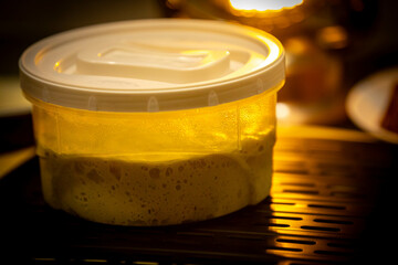 Calabrian sausage pizza served on a round board and set table