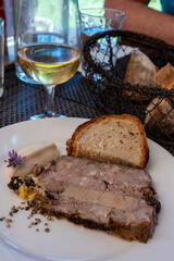 Terrine foie gras fat liver specialty food product made of liver of a duck or goose fattened by force feeding, served in French restaurant in Perigoed, Dordogne, close up