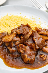 Meat dish Caramel pork served with couscous