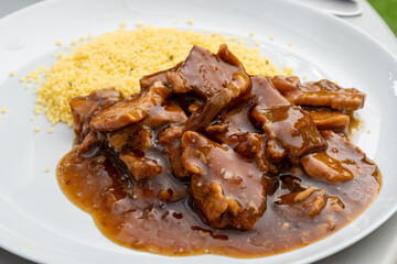 Meat dish Caramel pork served with couscous