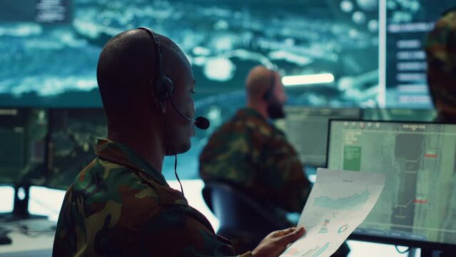 Military personnel execute electronic intelligence gathering missions to intercept enemy communications or warships gps positions. Soldiers conducting reconnaissance operations. Camera A.