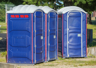 rows of portable toilet outdoor